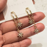 Gold Star Dangle Earrings